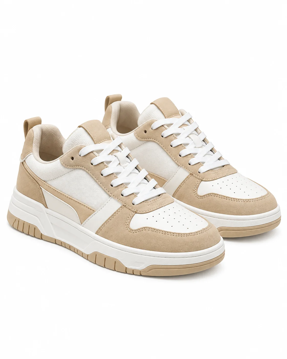 Pair of beige and white sneakers isolated on a white background