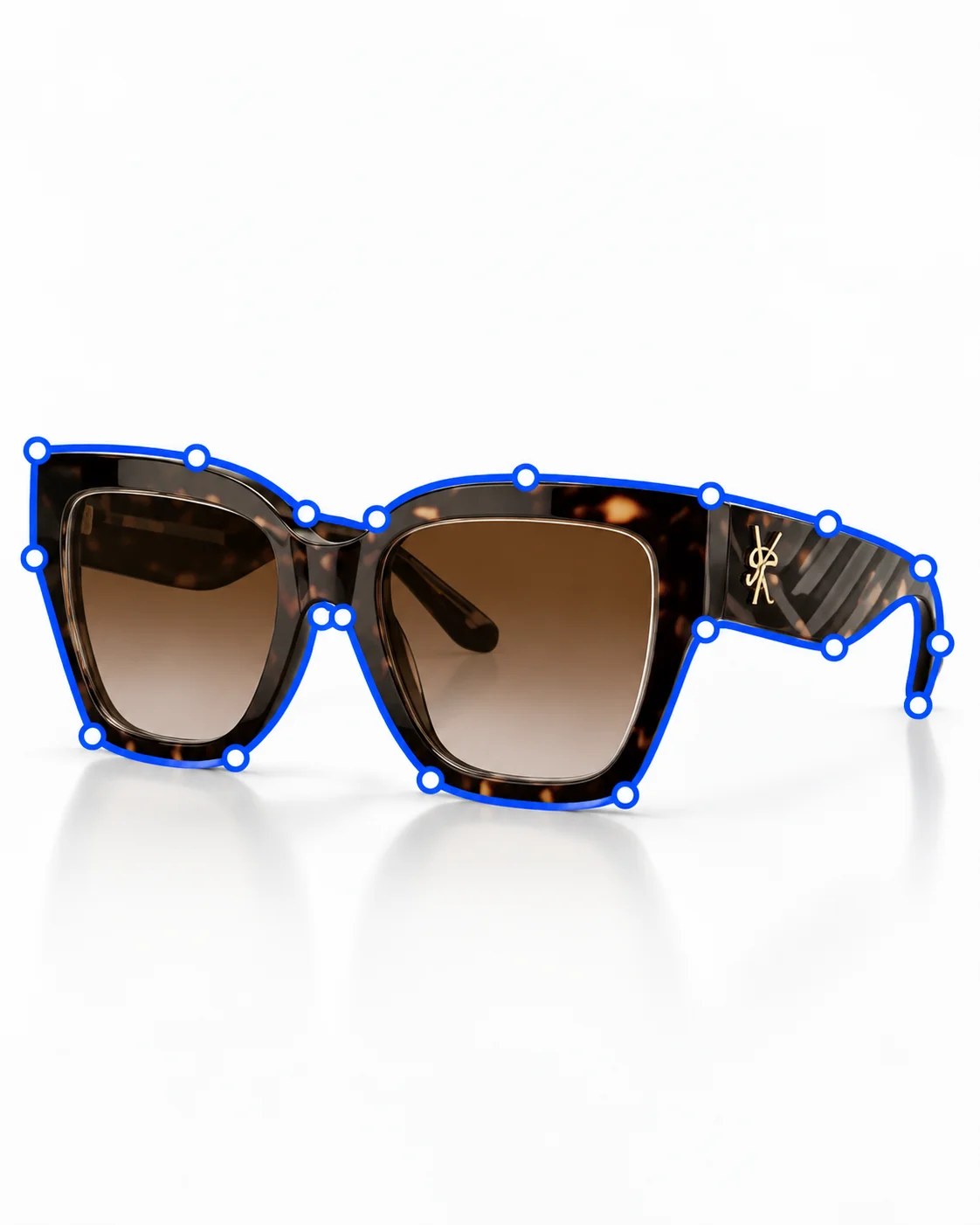 Designer sunglasses with frame and lens contours traced for clipping