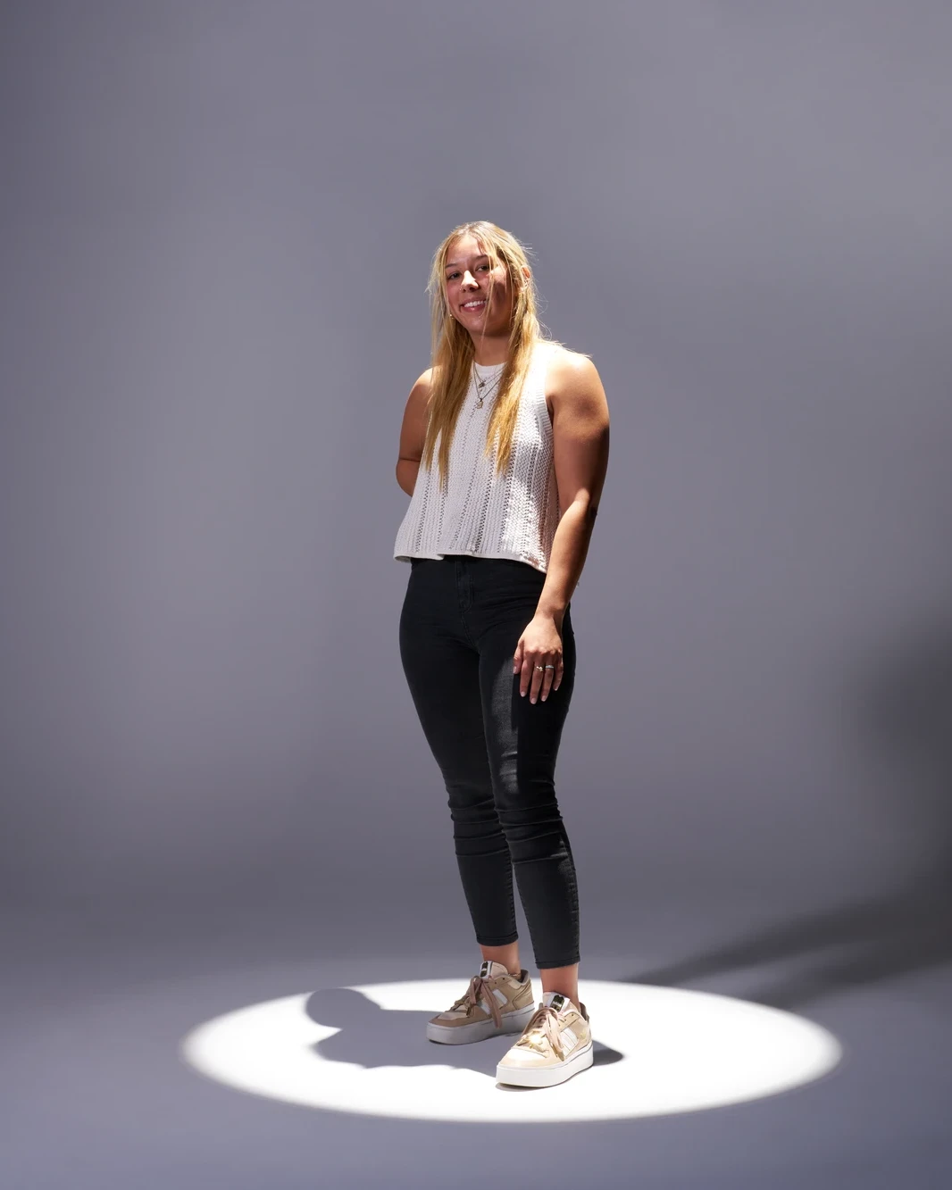 Fashion portrait finished under a dramatic studio spotlight