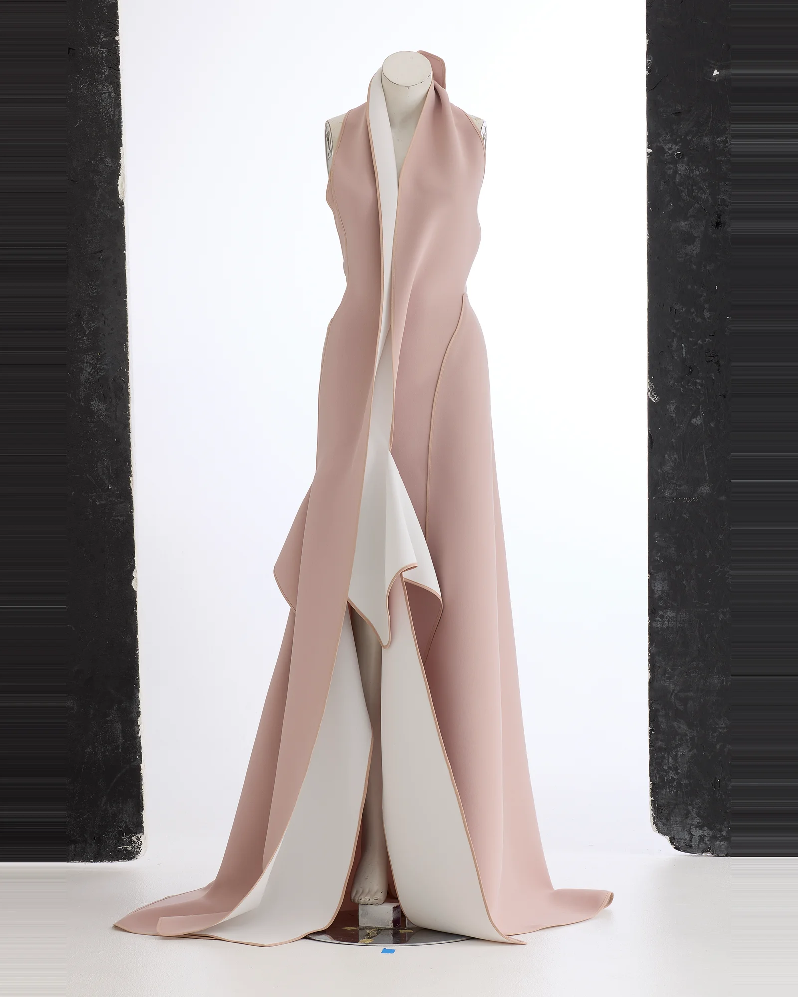 Blush gown photographed on a visible mannequin against a studio backdrop