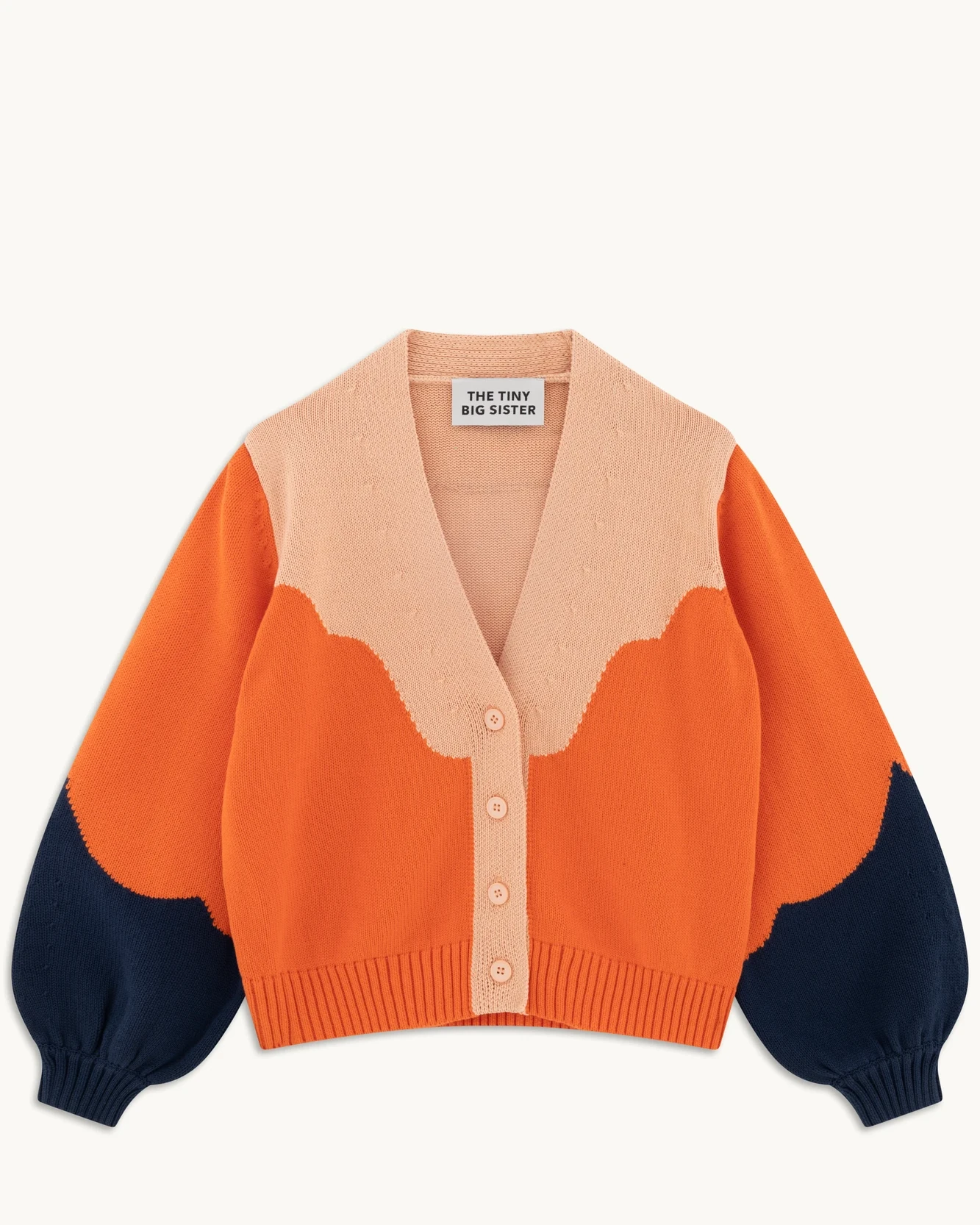 Colorblock knit cardigan finished as a clean apparel flat lay